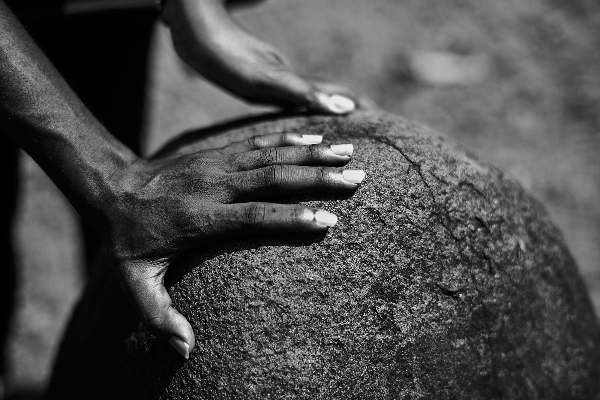 Touching Wisdom Stone. Open Air Monoliths Museum, Ikom (Nigeria–Cameroun Border Town), Nigeria. From Dream Chamber, 2018.