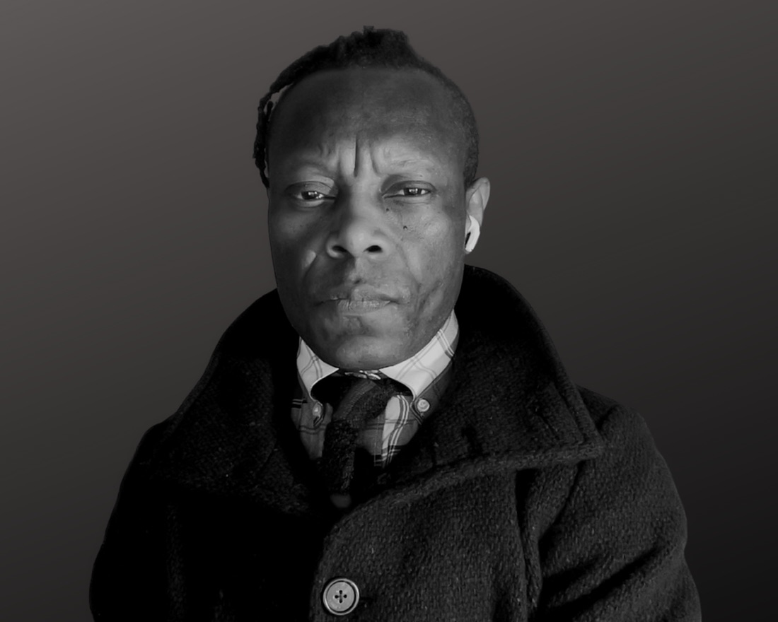 Photographic portrait of Olu Oguibe, as printed for the installation.